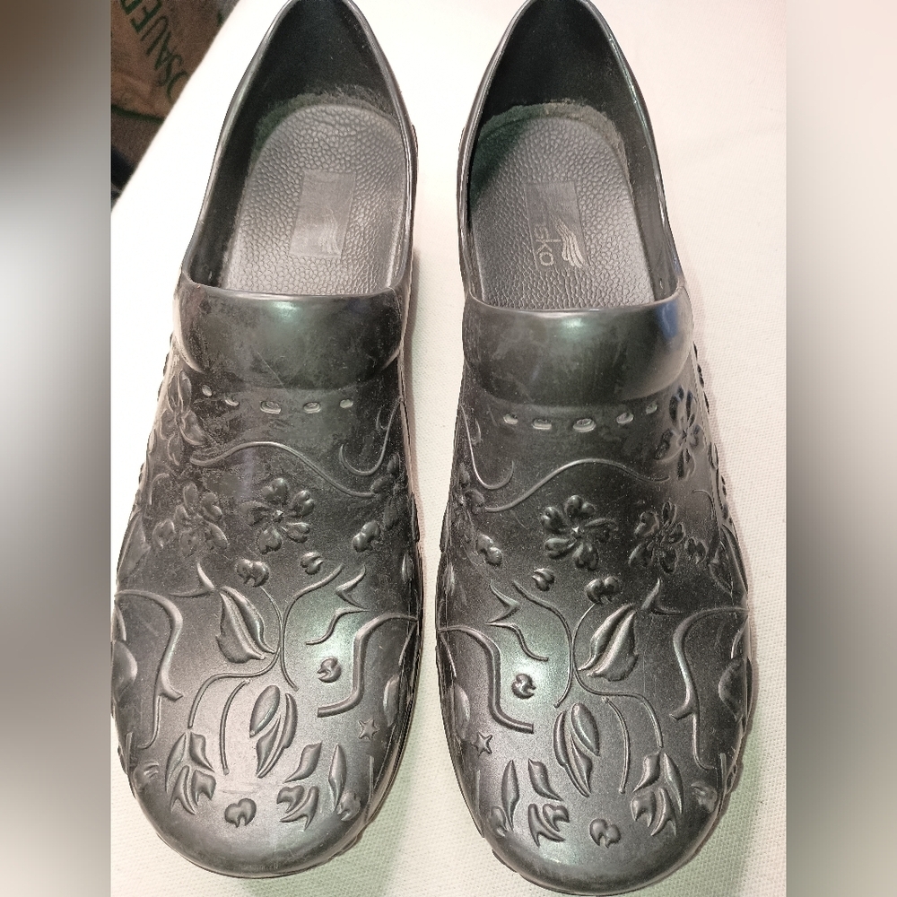 Elegance in Every Step: Embossed Floral Black Clogs by Dansko (#1,230)